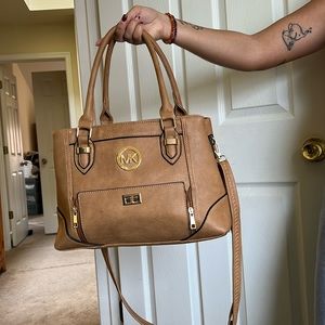 MK purse with over body strap.